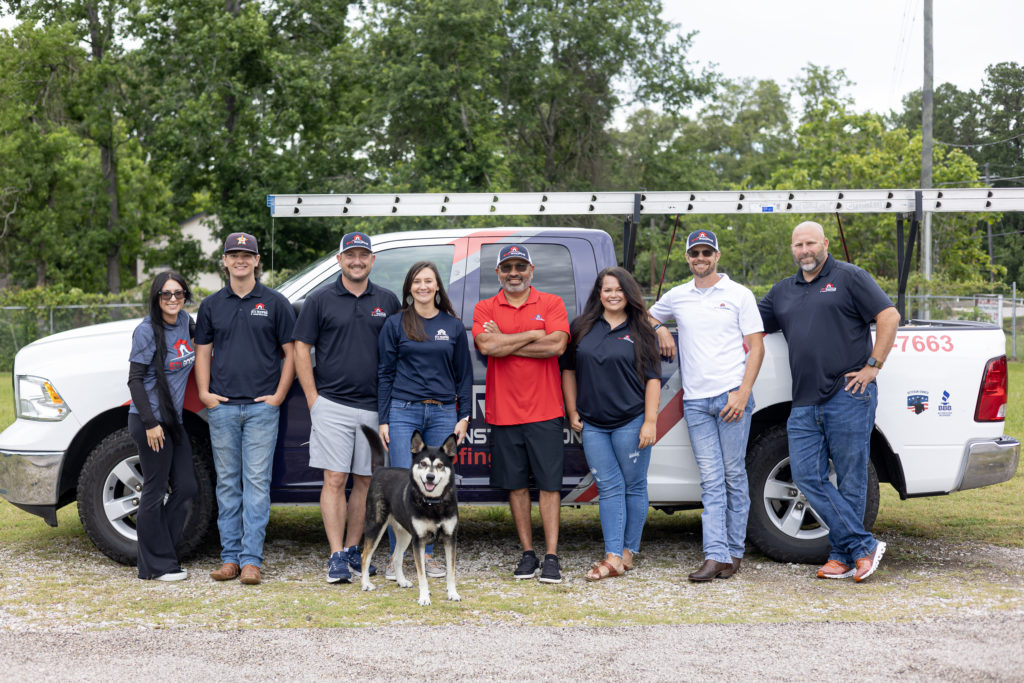 The Owner and Employees of STX Roofing posing in front of their truck