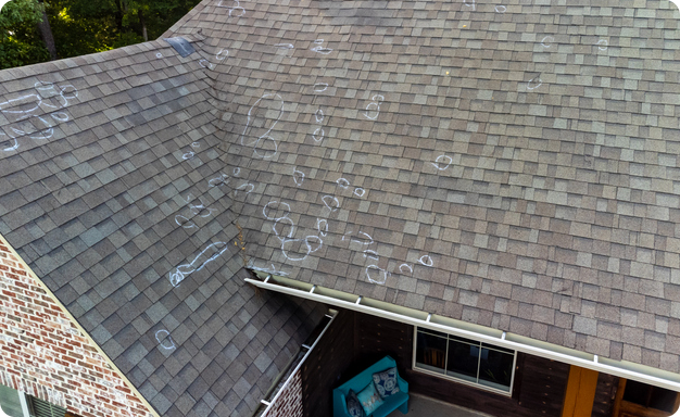 Aging roof with damaged highlighted by chalk marks