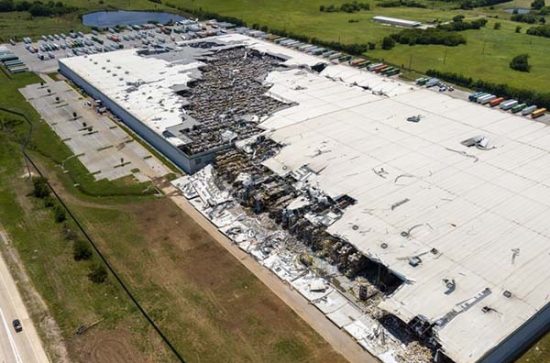 Warehouse devastated by tornado. Severe damage to industrial building in rural Oklahoma Warehouse devastated by tornado. Severe damage to industrial building in rural Oklahoma