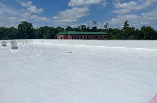 Finished Commercial Roof Coating in Houston – STX Roofing Finished commercial flat roof coating in Houston TX with white reflective energy-efficient roof system