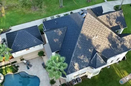 shingle-roof-replacement-houston-tx-stx-roofing Aerial view of a new shingle roof replacement on a Houston TX home by STX Roofing
